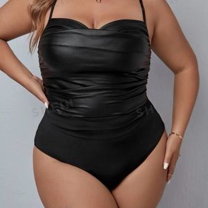 Faux leather bodysuit with cotton-blend bottom. Never worn.